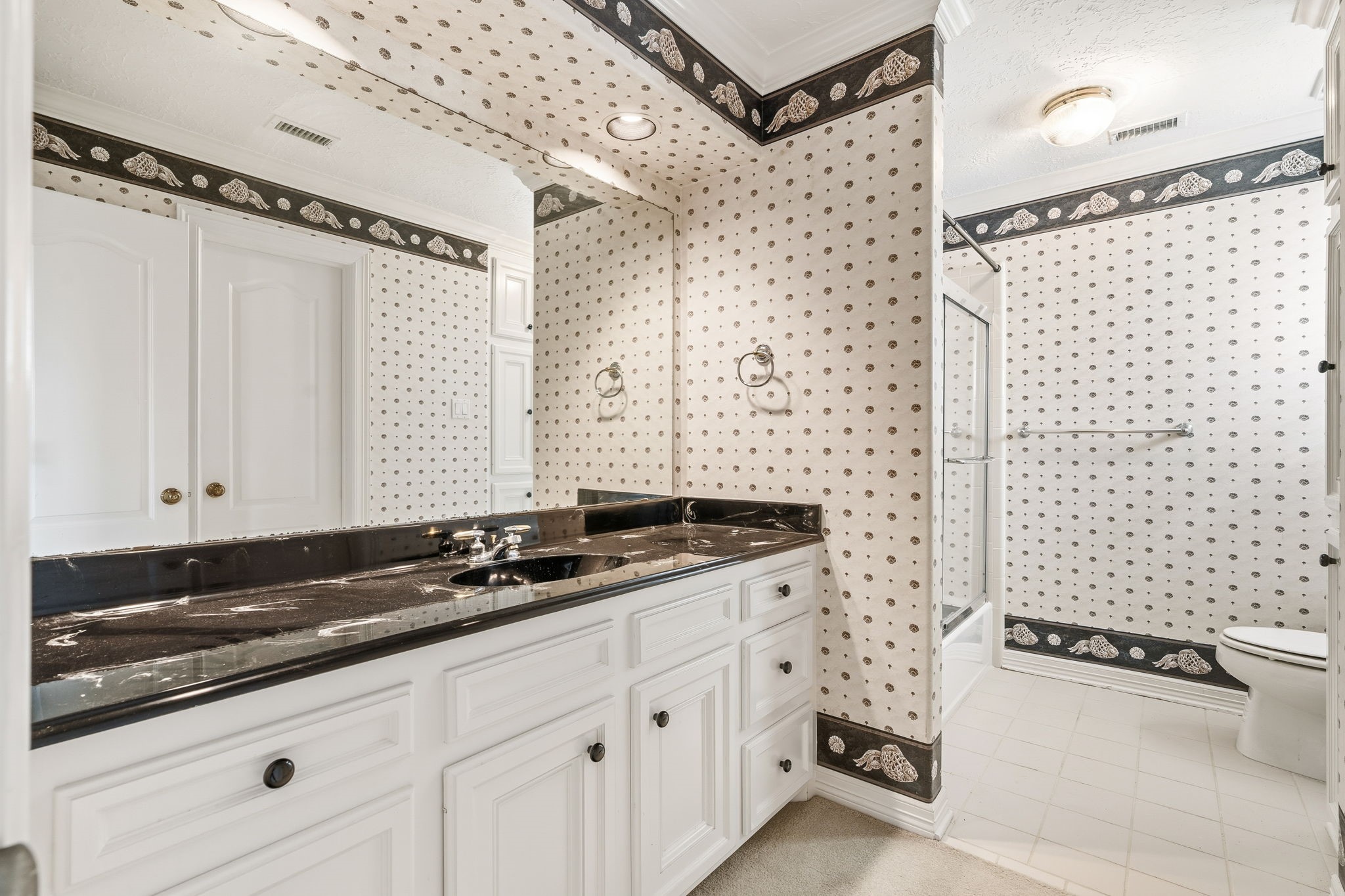106 Cove Point Montgomery, TX 77356 - Photo 26 of 48 a bathroom with a granite countertop sink a toilet a mirror and shower