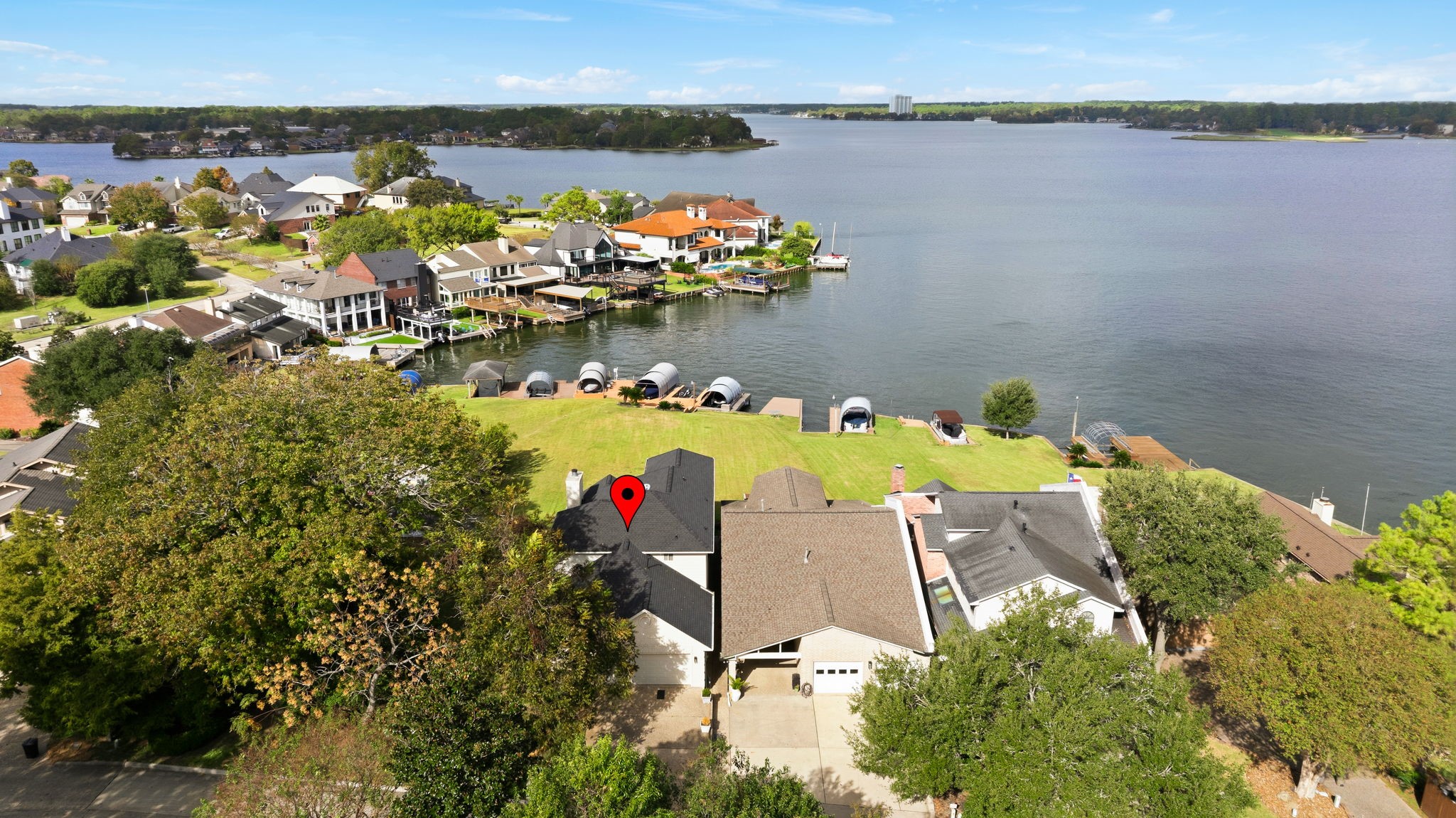 106 Cove Point Montgomery, TX 77356 - Photo 36 of 48 an aerial view of a house with swimming pool and lake view