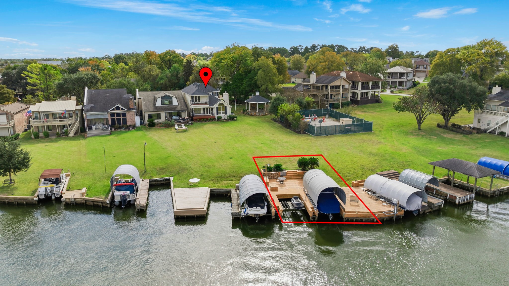 106 Cove Point Montgomery, TX 77356 - Photo 37 of 48 a couple of cars parked in front of a lake with houses