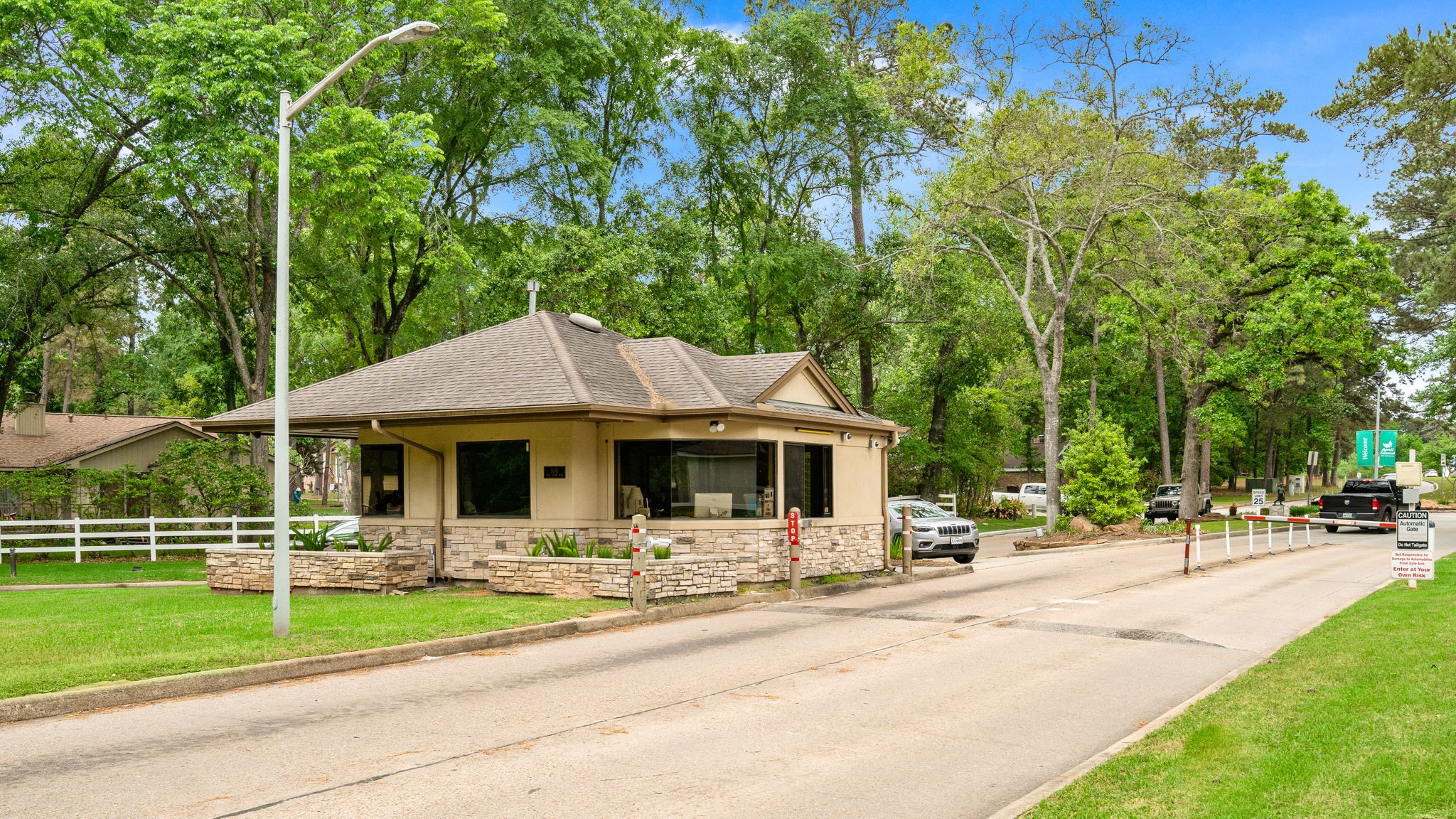 106 Cove Point Montgomery, TX 77356 - Photo 40 of 48 a front view of a house with a yard table and chairs