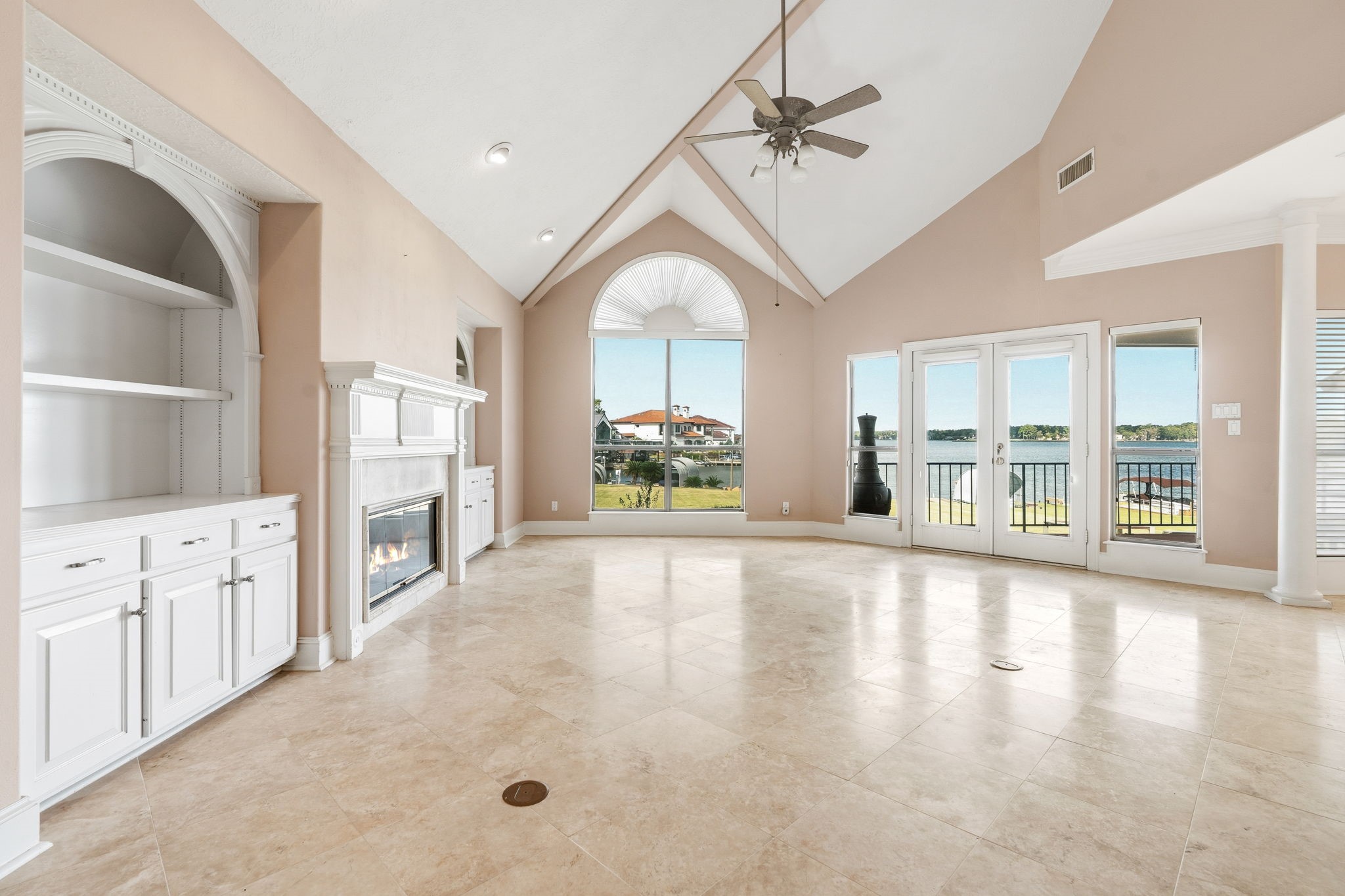 106 Cove Point Montgomery, TX 77356 - Photo 7 of 48 a view of an empty room with a window and a kitchen