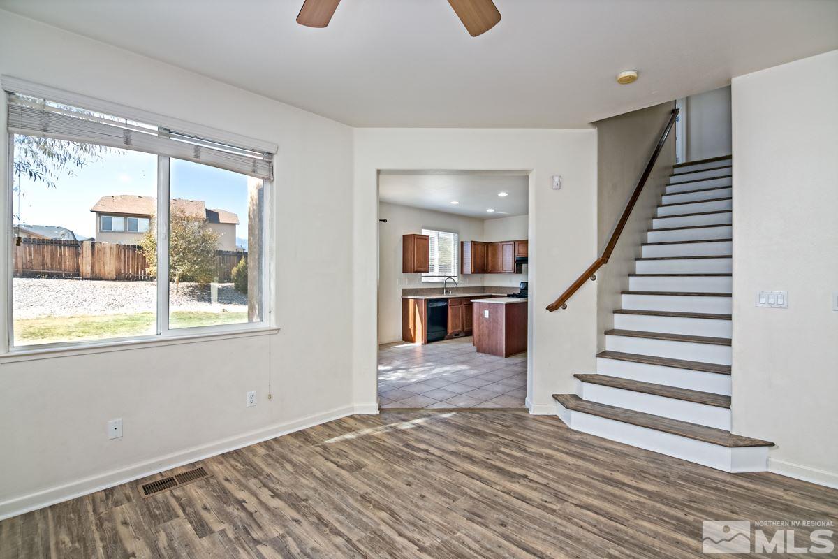 2324 Clementine Lane Reno, NV 89521 - Photo 5 of 23 a view of a livingroom with wooden floor and stairs