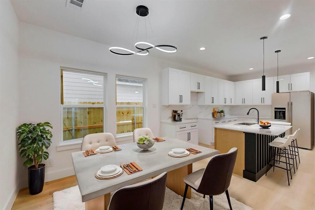 4515 Wahoo Street Dallas, TX 75210 - Photo 12 of 36 Dining space with light wood finished floors and recessed lighting