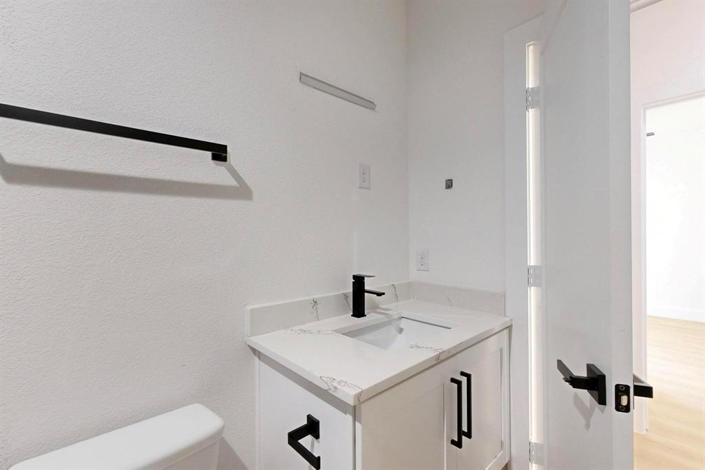 4515 Wahoo Street Dallas, TX 75210 - Photo 22 of 36 Bathroom featuring vanity and toilet