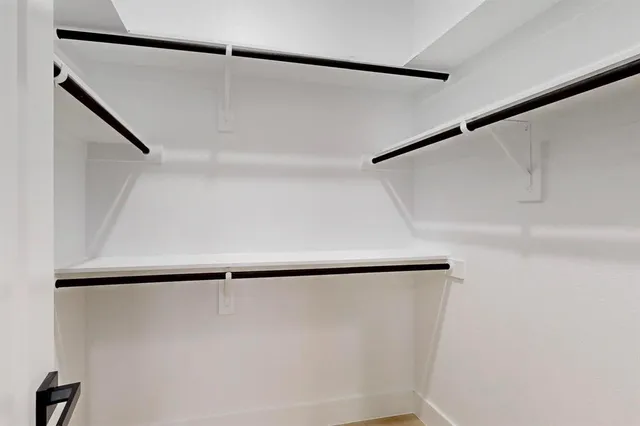 a view of room with window and ceiling fan