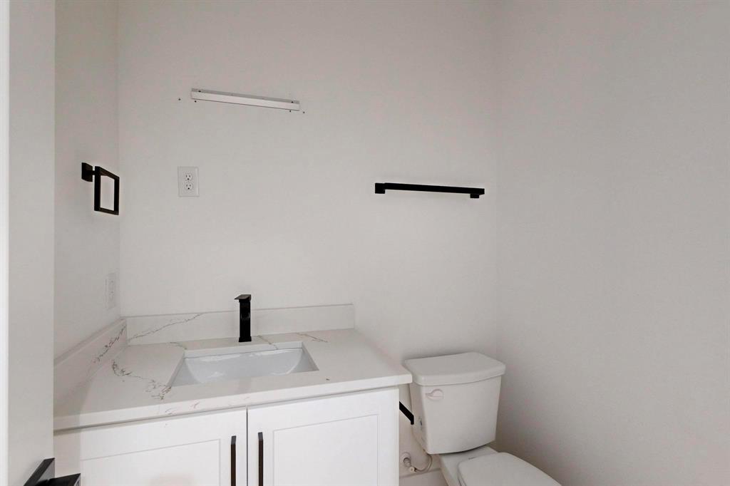 4515 Wahoo Street Dallas, TX 75210 - Photo 32 of 36 Bathroom with toilet and vanity