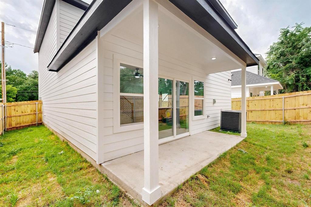 4515 Wahoo Street Dallas, TX 75210 - Photo 33 of 36 Rear view of property featuring a patio area and a fenced backyard