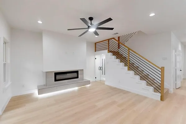 a view of entryway and hall with a ceiling fan