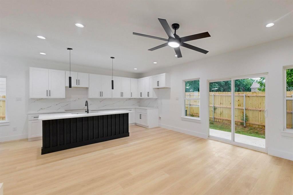 4515 Wahoo Street Dallas, TX 75210 - Photo 9 of 36 Kitchen with plenty of natural light, tasteful backsplash, white cabinetry, and recessed lighting