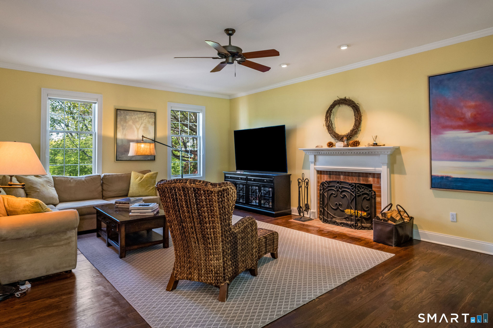170 Devonshire Lane Madison, CT 06443 - Photo 13 of 39 a living room with furniture a fireplace and a flat screen tv