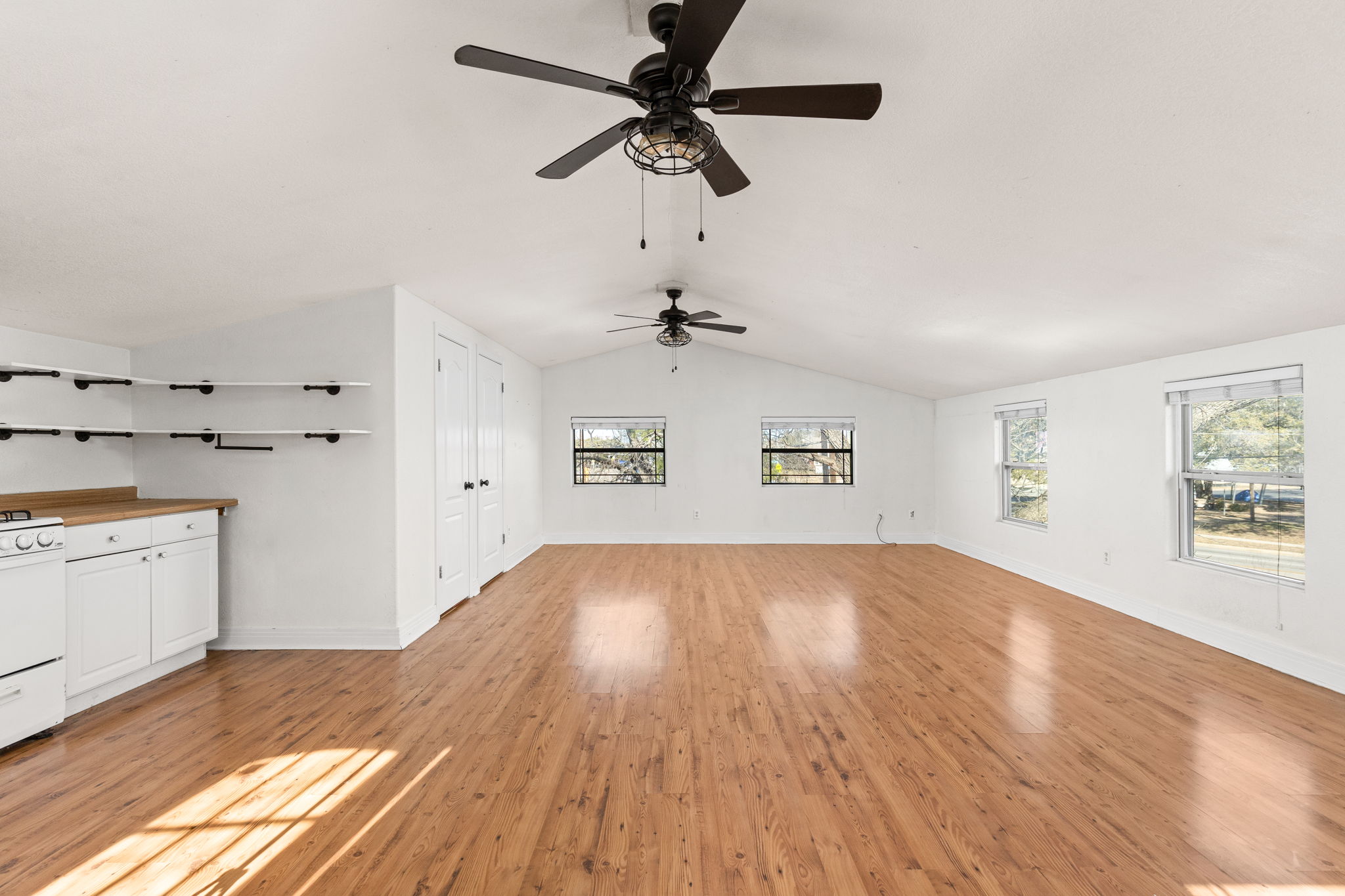 2203 Lindell Avenue Austin, TX 78704 - Photo 28 of 39 Unfurnished living room with light wood-type flooring and a ceiling fan