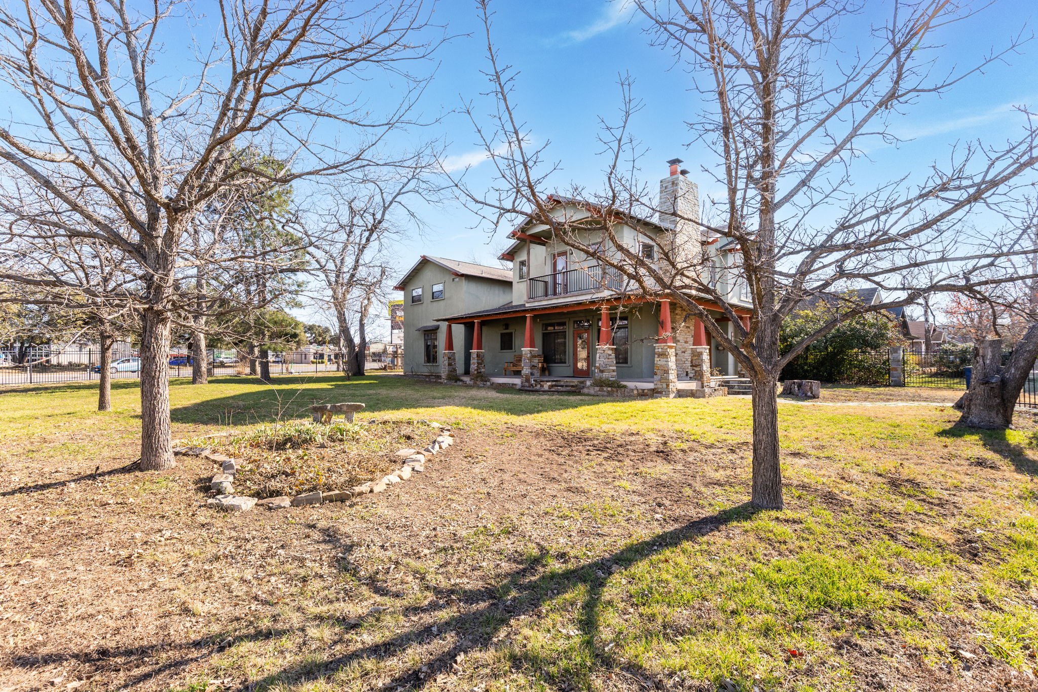 2203 Lindell Avenue Austin, TX 78704 - Photo 33 of 39 View of front of house with covered porch, a chimney, and a front lawn