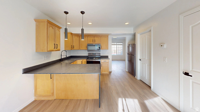 1115 North Main Street Bountiful, UT 84010 - Photo 2 of 17 Kitchen featuring wood-finish cabinetry, dark countertops, and stainless steel appliances
