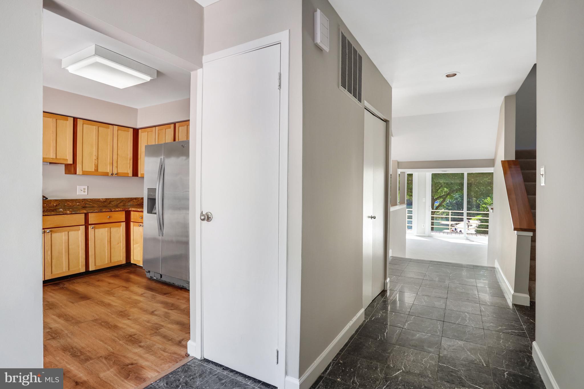 1953 Lakeport Way Reston, VA 20191 - Photo 18 of 60 a view of a kitchen with an empty space and a window