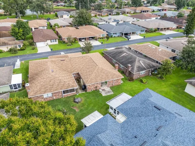 an aerial view of houses with outdoor space