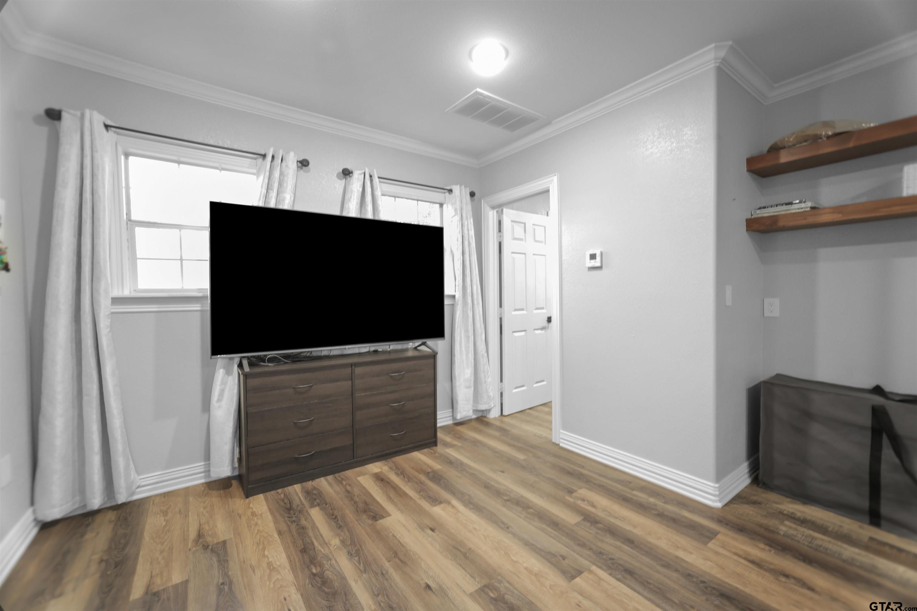 11931 State Highway 64 Tyler, TX 75704 - Photo 36 of 44 a bedroom with closet and flat screen tv