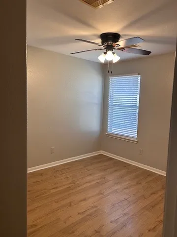 a view of a chandelier fan in a room