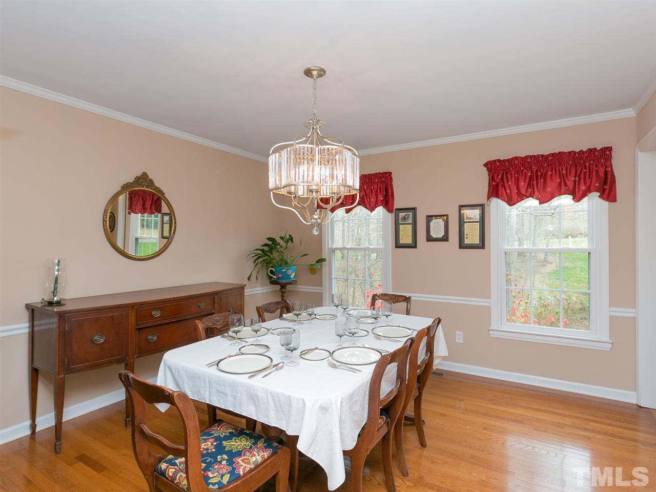 5400 Deep Valley Run Raleigh, NC 27606 - Photo 3 of 25 a view of a dining room with furniture window and wooden floor