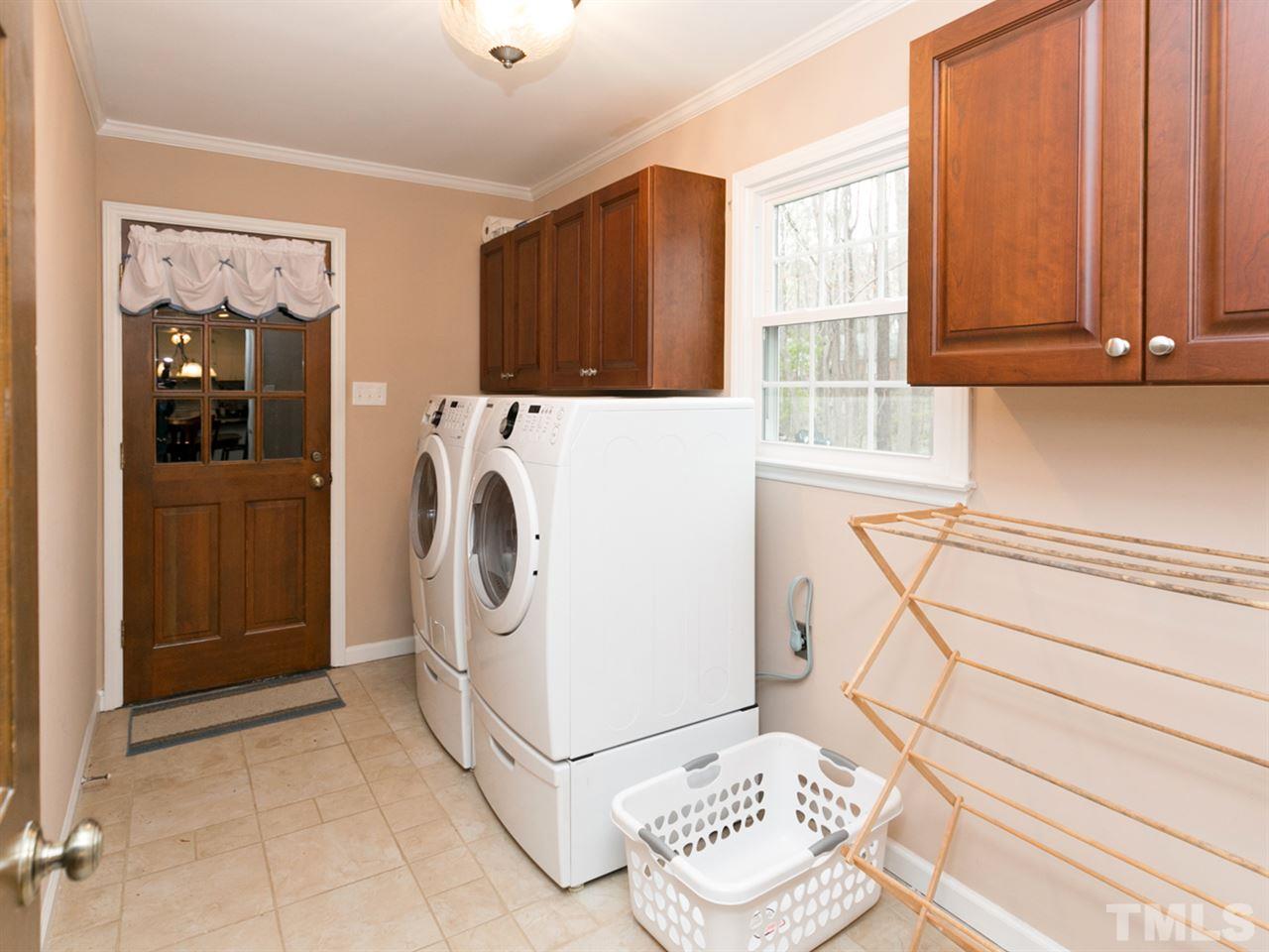 5400 Deep Valley Run Raleigh, NC 27606 - Photo 8 of 25 a view of kitchen with washer and dryer