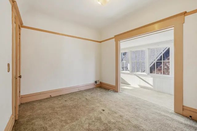 an empty room with a ceiling fan and a ceiling fan