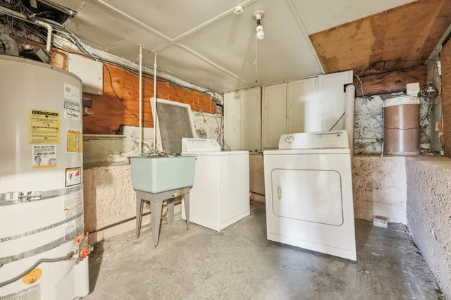 a view of garden with wooden fence
