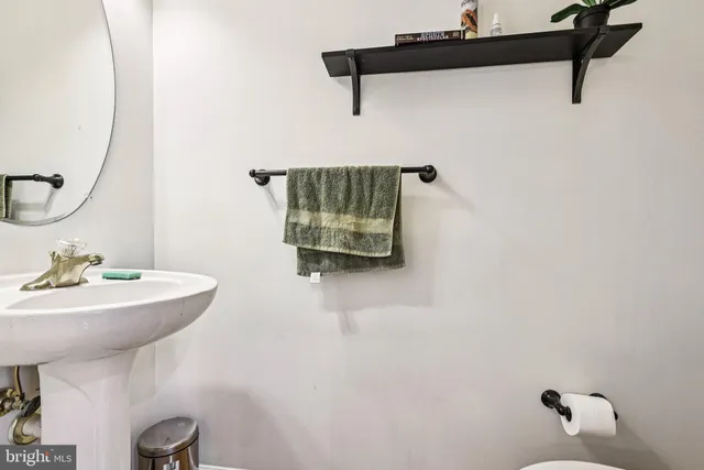 a bathroom with a sink a mirror and shower