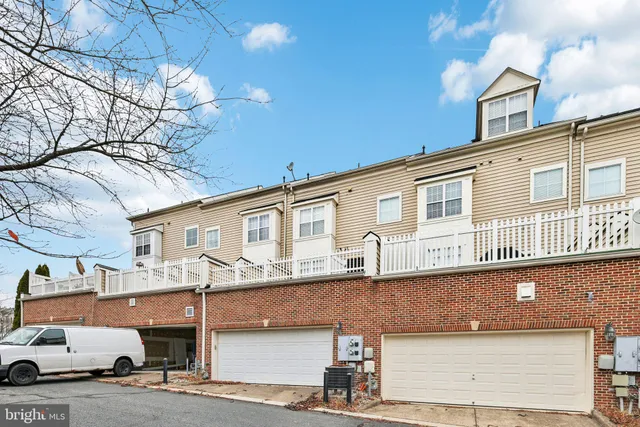 a front view of a building with parking