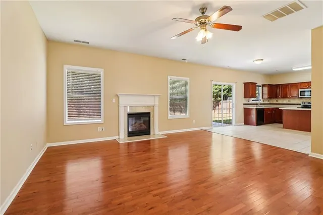 a kitchen with stainless steel appliances granite countertop a stove a sink dishwasher a refrigerator and a oven