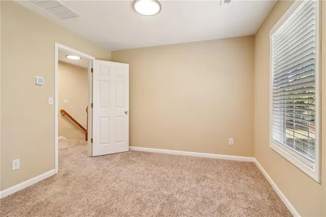 a bathroom with a granite countertop sink mirror and a bathtub
