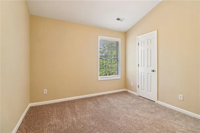 a backyard of a house with lots of green space