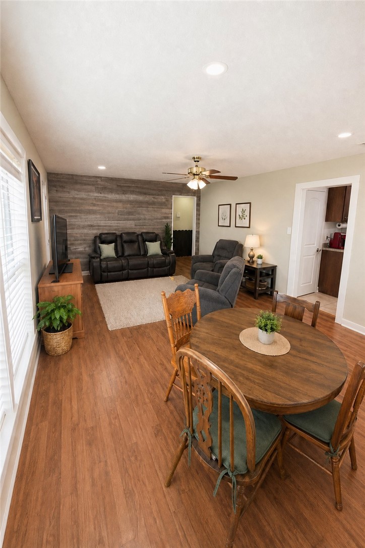 421 South Commerce Street Centerville, TX 75833 - Photo 13 of 23 a view of a dining room with furniture window and wooden floor