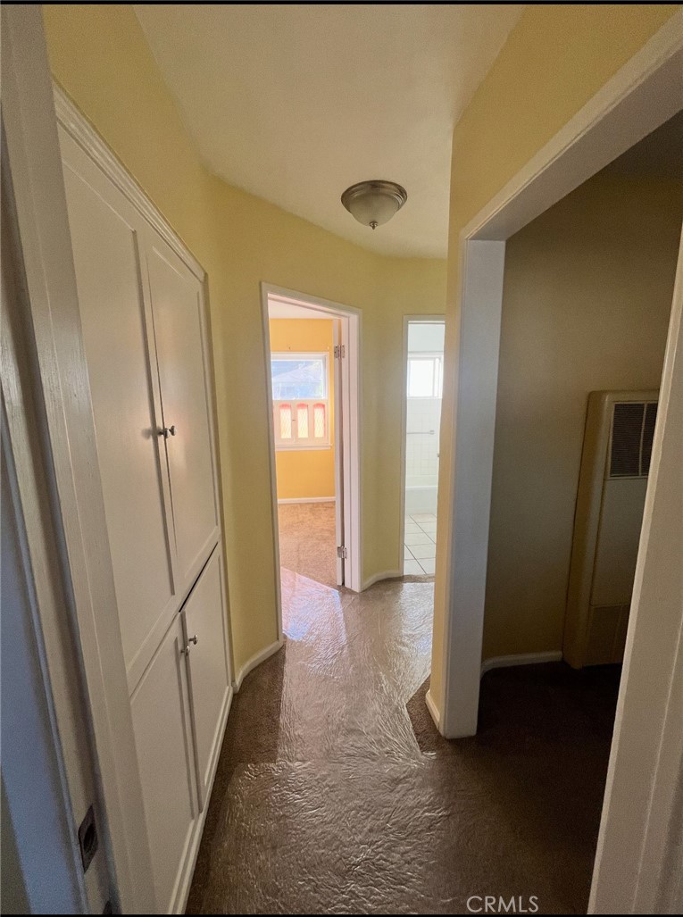 4136 Eileen Street Riverside, CA 92504 - Photo 5 of 11 a view of a hallway with wooden floor