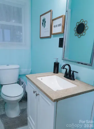 a bathroom with a toilet and a sink