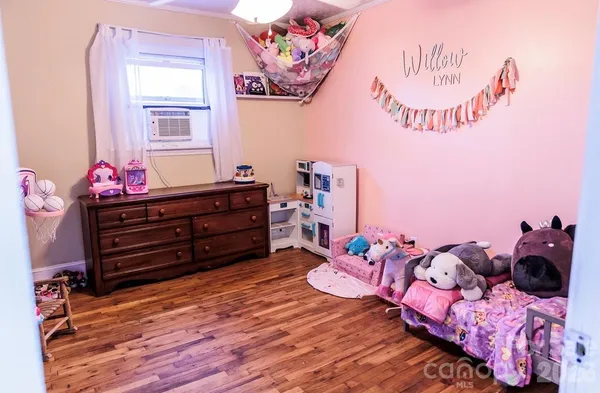 a bed room with a bed and a window