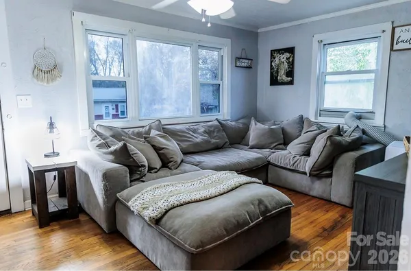 a living room with furniture and a window