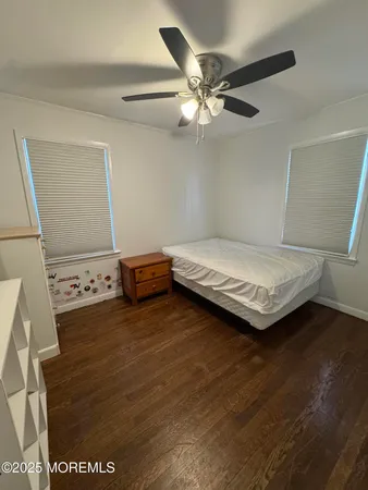 a bedroom with a bed and cabinets