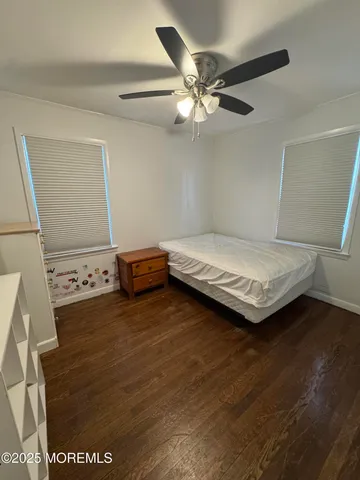 a bedroom with a bed and cabinets