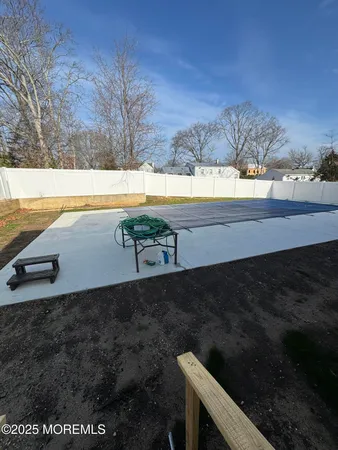a view of a swimming pool with an outdoor space