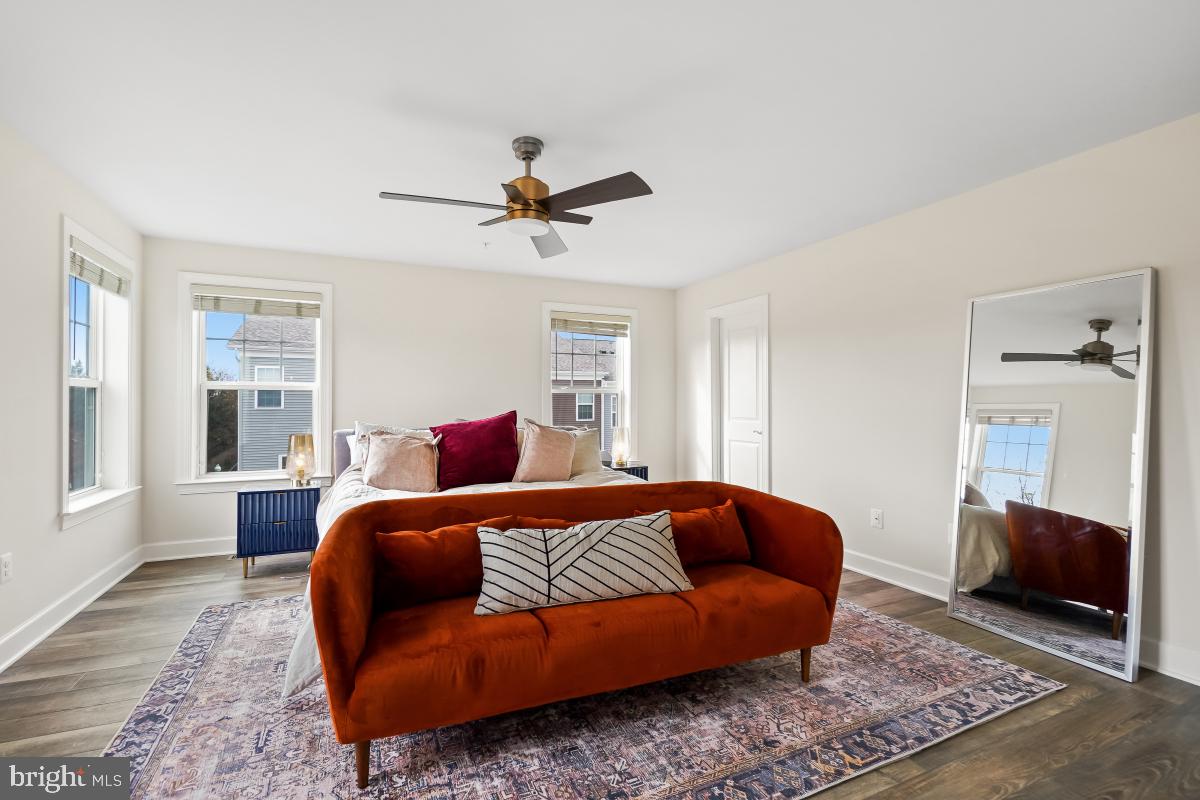 2945 Duvall Ridge Road, Unit 573 Hyattsville, MD 20785 - Photo 11 of 23 a living room with furniture a ceiling fan and a rug