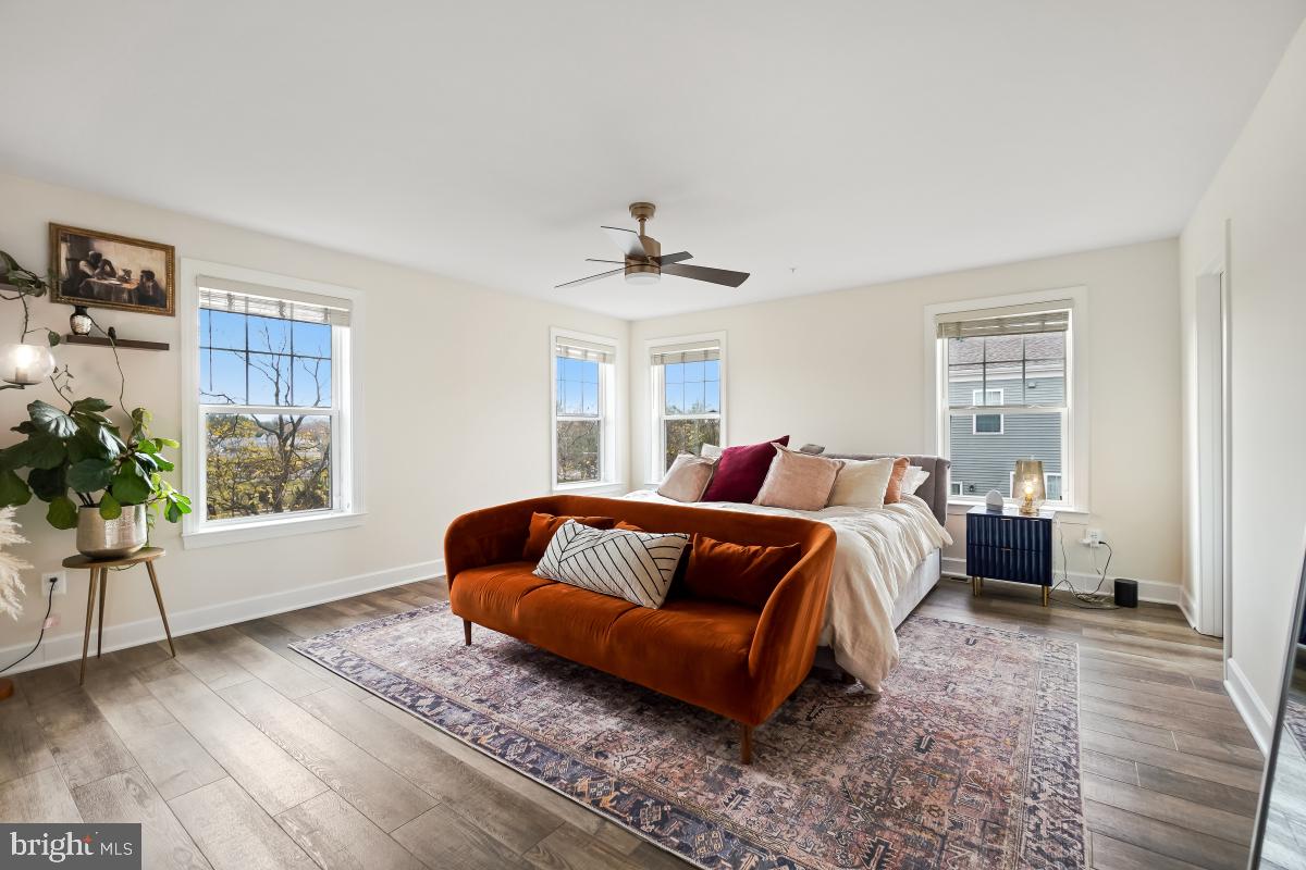 2945 Duvall Ridge Road, Unit 573 Hyattsville, MD 20785 - Photo 12 of 23 a bed room with a bed and a window