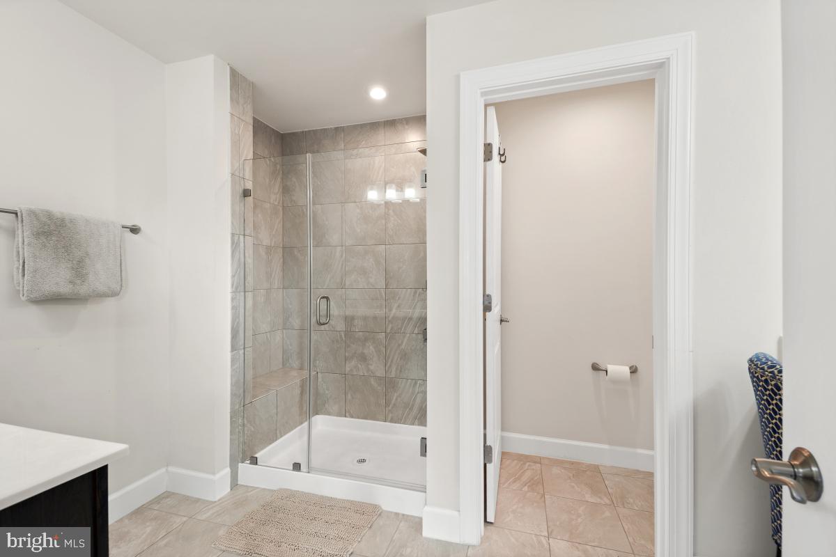 2945 Duvall Ridge Road, Unit 573 Hyattsville, MD 20785 - Photo 13 of 23 a bathroom with a shower and a toilet