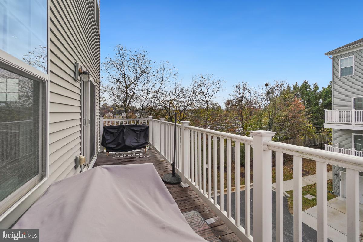 2945 Duvall Ridge Road, Unit 573 Hyattsville, MD 20785 - Photo 19 of 23 a view of a balcony with trees