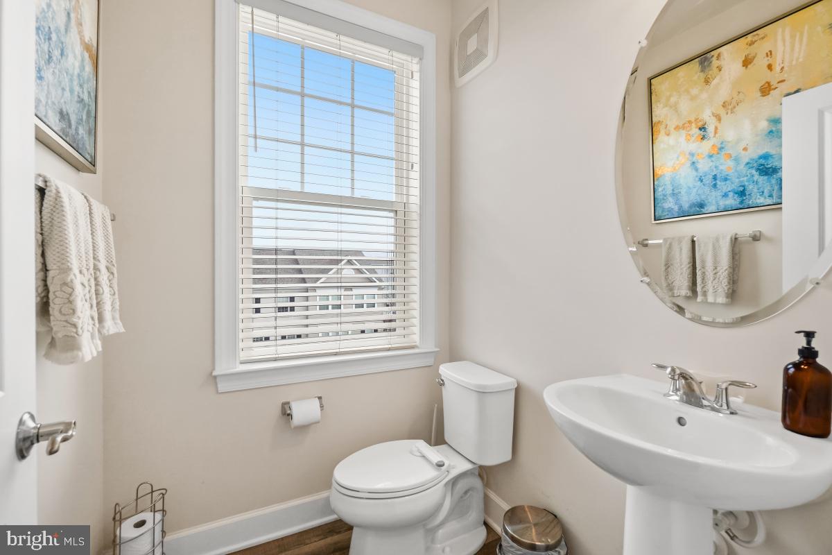 2945 Duvall Ridge Road, Unit 573 Hyattsville, MD 20785 - Photo 10 of 23 a bathroom with a sink a toilet and a mirror