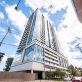 a view of a building with a yard