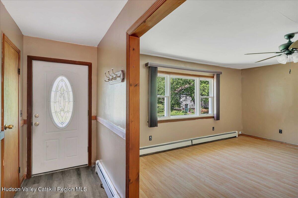 35 Banta Lane Cairo, NY 12413 - Photo 13 of 33 an empty room with wooden floor mirror and windows
