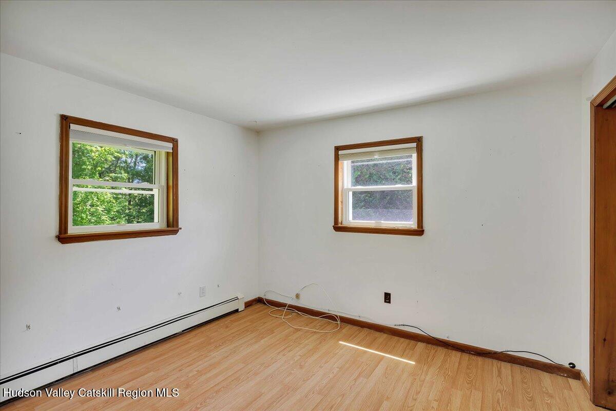 35 Banta Lane Cairo, NY 12413 - Photo 16 of 33 a view of an empty room with a window and wooden floor