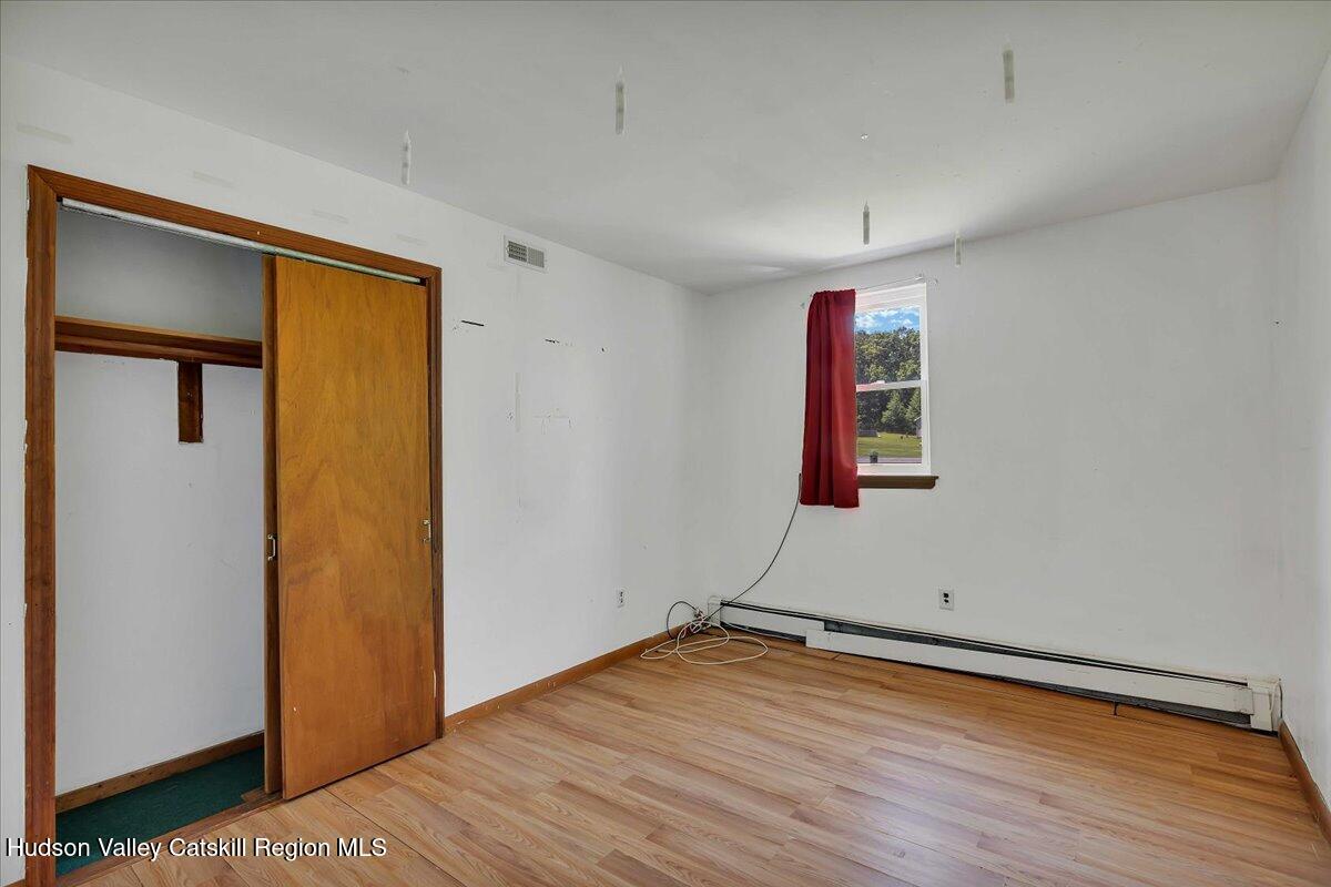 35 Banta Lane Cairo, NY 12413 - Photo 24 of 33 an empty room with wooden floor and closet
