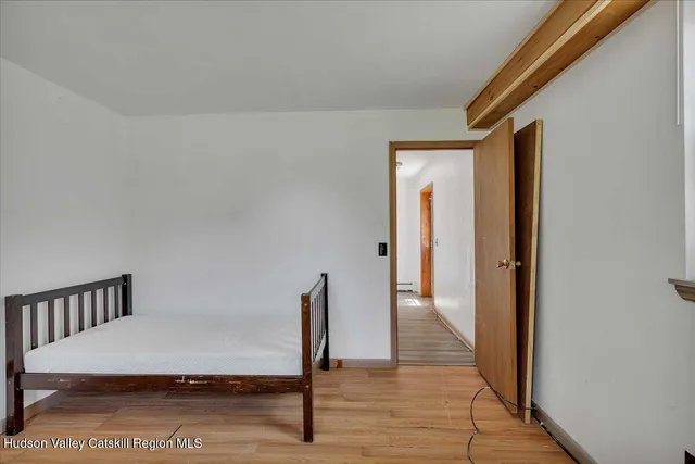 an empty room with windows and closet