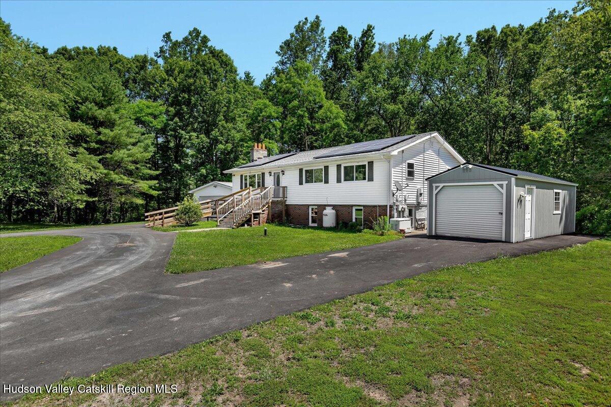 35 Banta Lane Cairo, NY 12413 - Photo 4 of 33 a front view of a house with a yard and trees