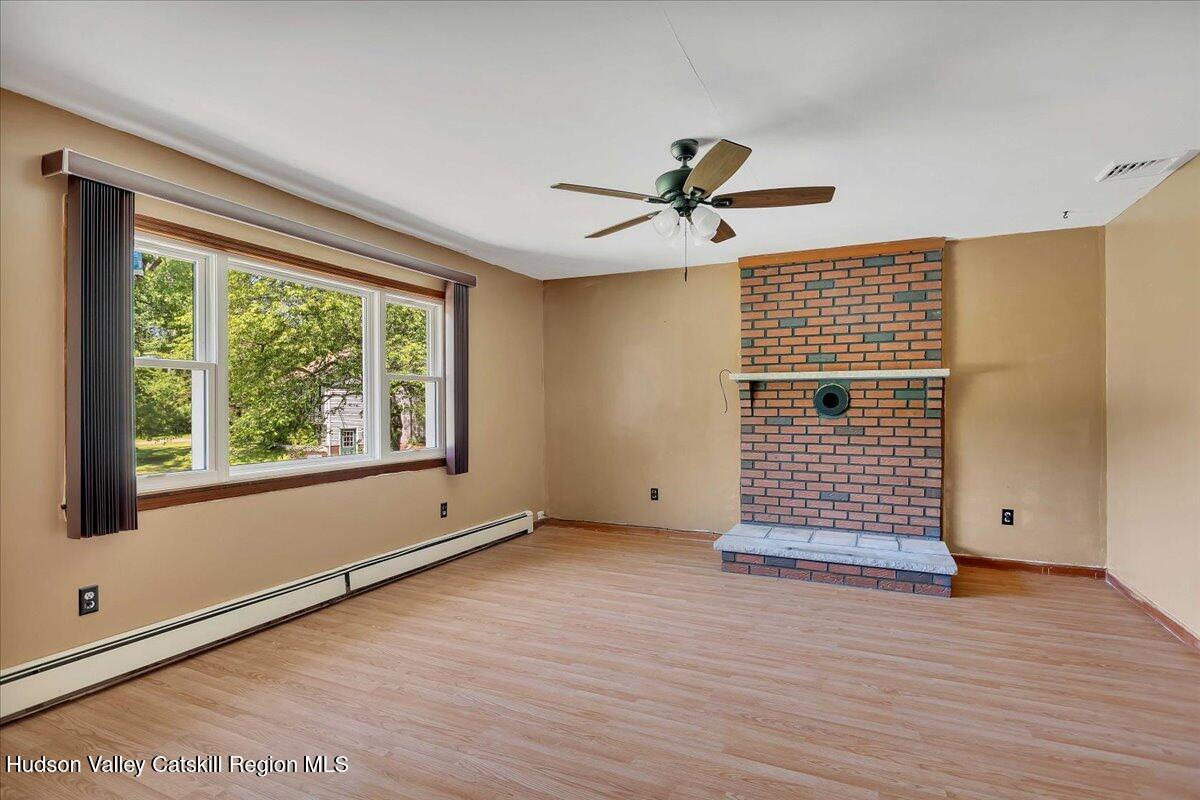 35 Banta Lane Cairo, NY 12413 - Photo 6 of 33 a view of empty room with wooden floor and fan